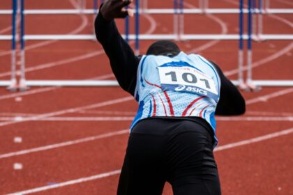 athletic's on starting line during daytime